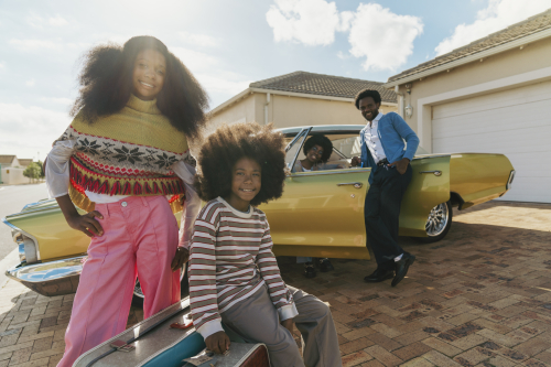 Kids in front of classic car