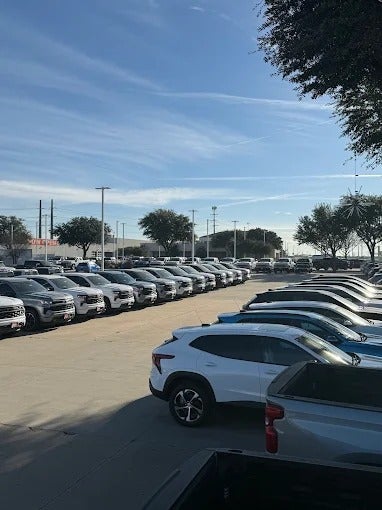 Rows of new Chevrolet vehicles on the lot at Jupiter Chevrolet in Garland, Texas