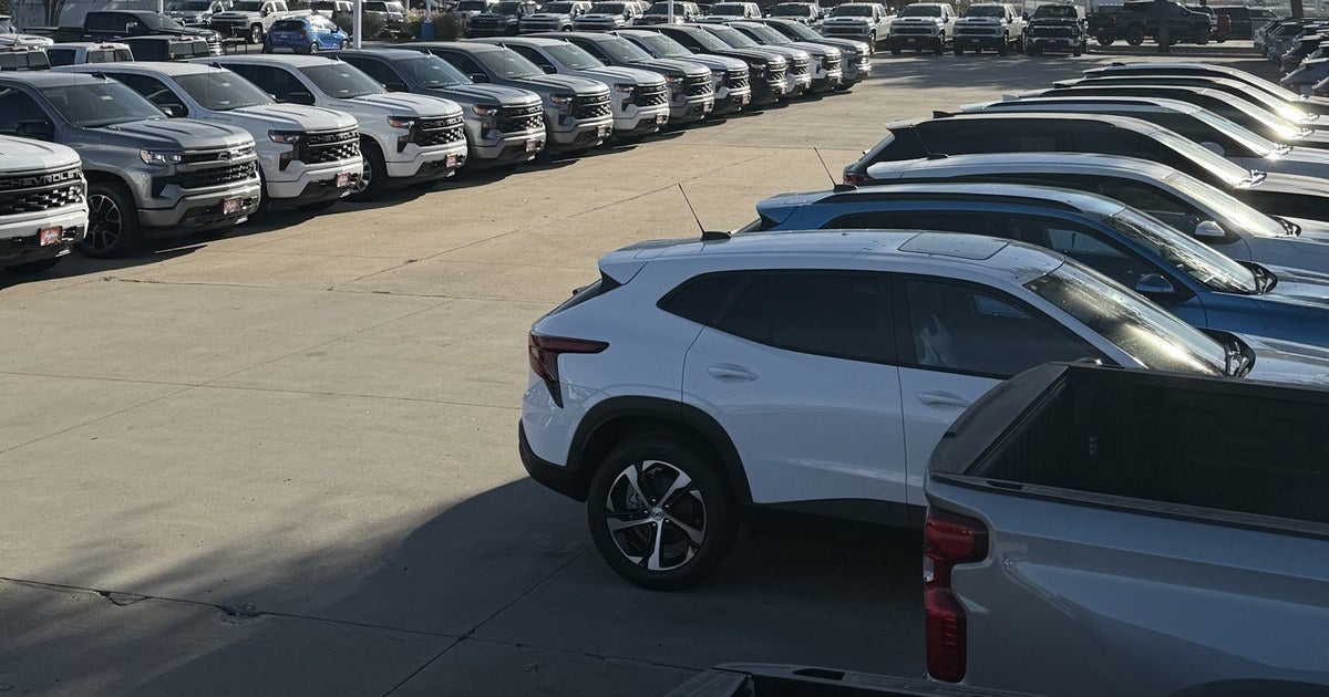 Rows of new Chevrolet trucks and SUVs on the lot at Jupiter Chevrolet in Garland, TX