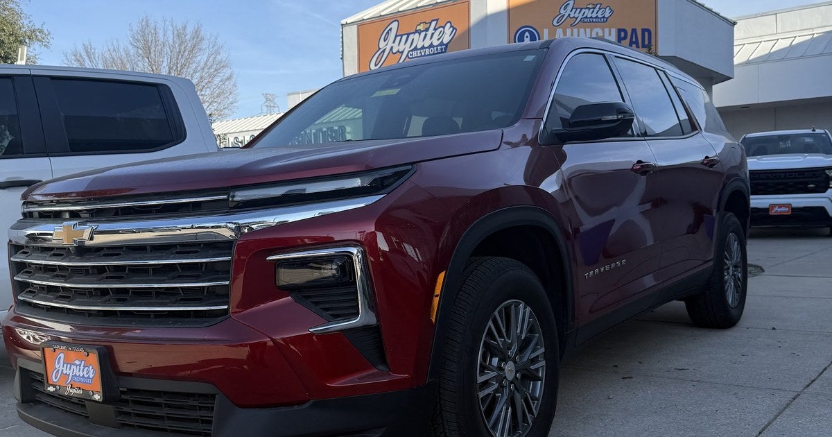 Chevrolet Traverse with a Jupiter Chevrolet plate parked outside the dealership in Garland, TX